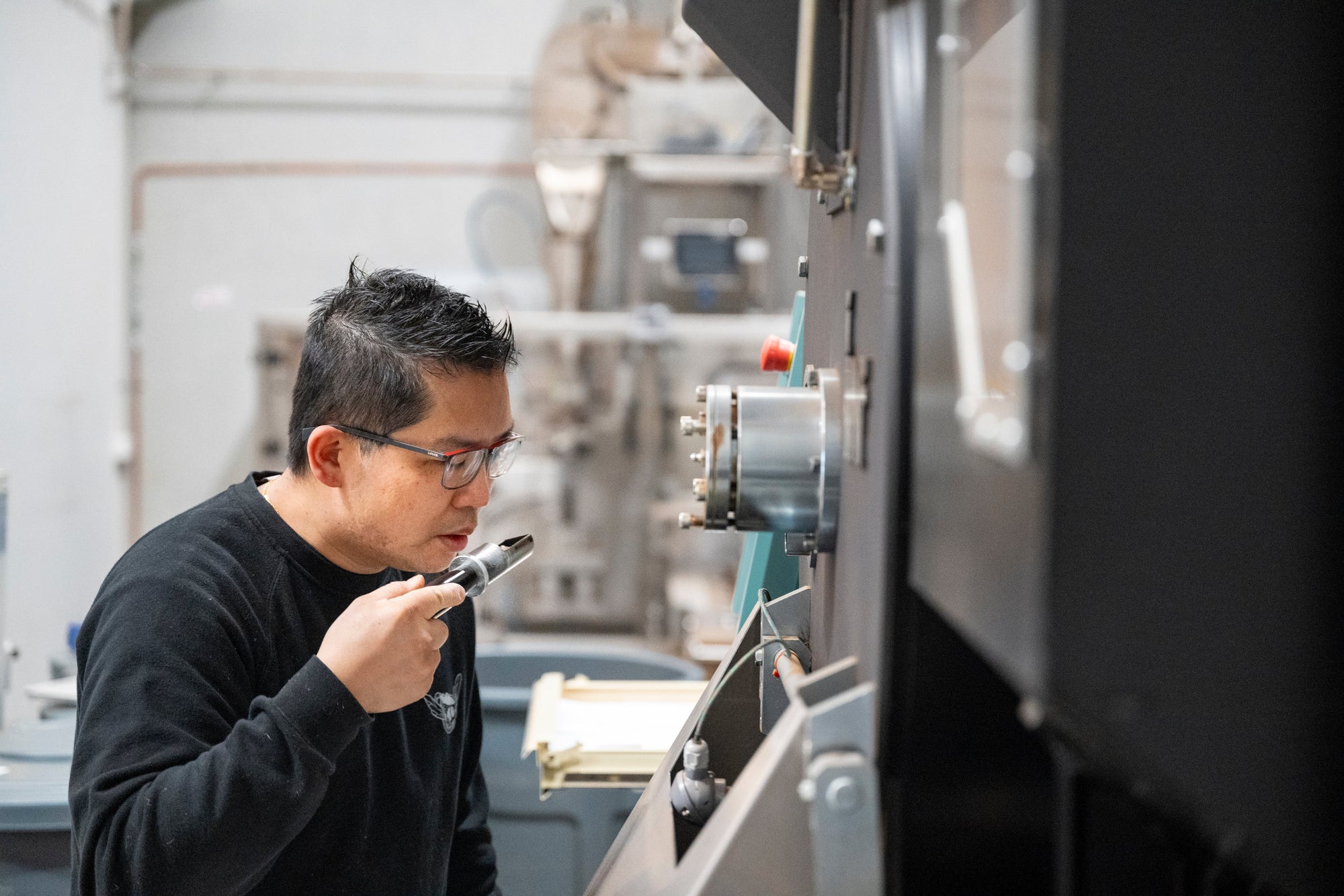 Master Roaster Alan from The Bean Cartel using IMF Roaster as featured in article in Perfect Daily Grind 