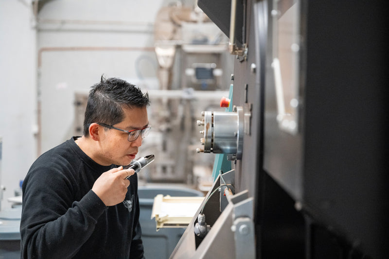 Master Roaster Alan from The Bean Cartel using IMF Roaster as featured in article in Perfect Daily Grind 